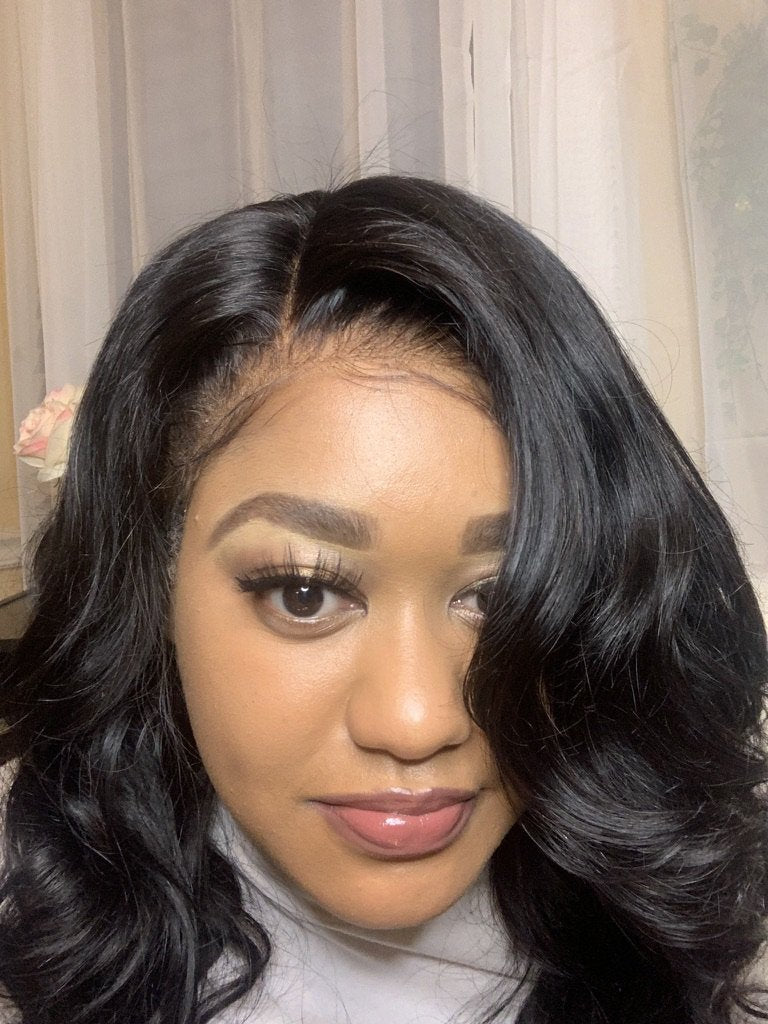 Seamless HD lace wig: A photo of a person wearing an HD lace wig that looks completely seamless and natural, as if it were their own hair.Bomb Dot Com Hair BombDotComHair