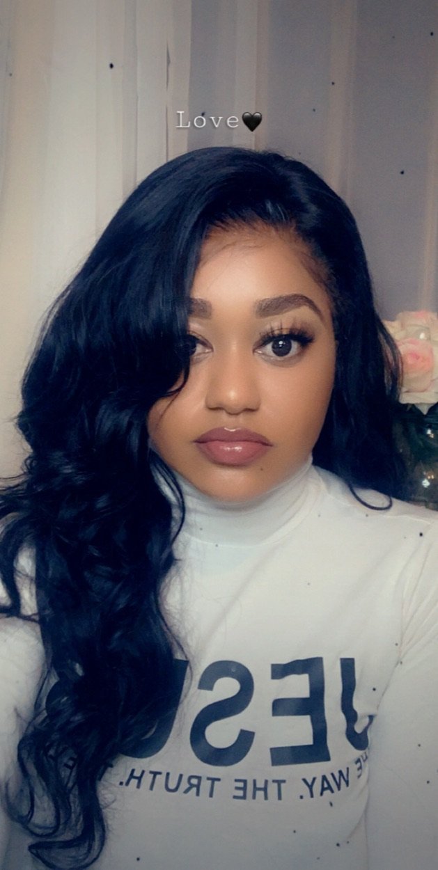 Seamless HD lace wig: A photo of a person wearing an HD lace wig that looks completely seamless and natural, as if it were their own hair. BombDotComHair